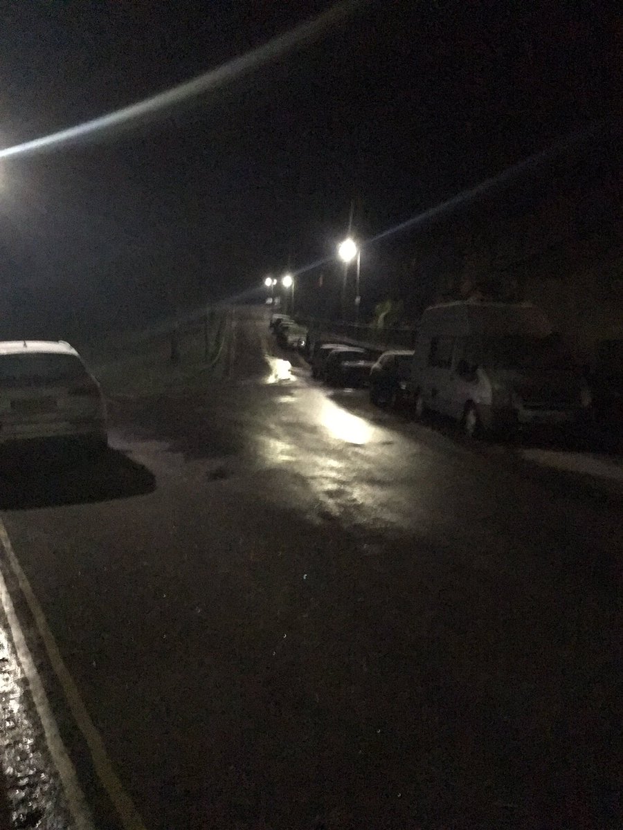 CharlieBath's tweet photo. Local ice rink courtesy @wessexwater. Told them about this mid-road mid-hill leak back in November. Still not fixed. It’s sheet and black ice in an area wider than I can capture https://t.co/GdClEPu4qo