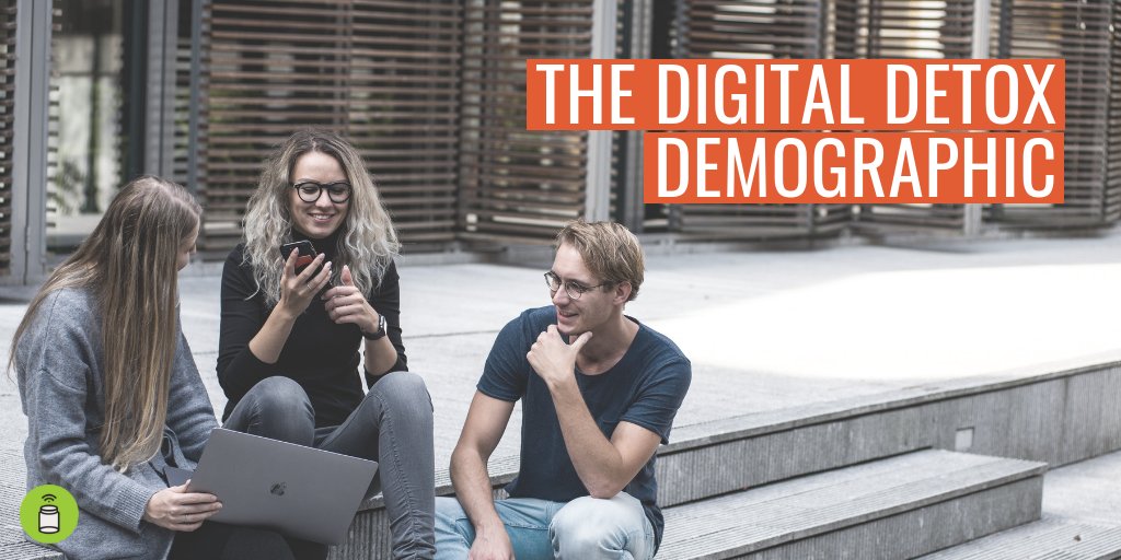 A group of students in conversation whilst on their phones. Text reads "The Digital Detox Demographic".
