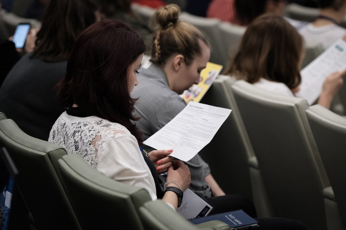 A ContentEd delegate reading in the crowd.