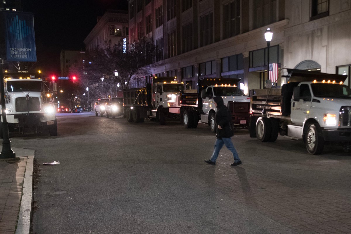 nedoliver's tweet photo. Quick look at Va. gun rally ~6:30 a.m.: 
-- Small groups, some heavily armed, milling around
-- A line is starting to form to get into the Capitol
-- Police preparing to deploy dump trucks to prevent car attacks on closed roadways https://t.co/L97NjVKTEw