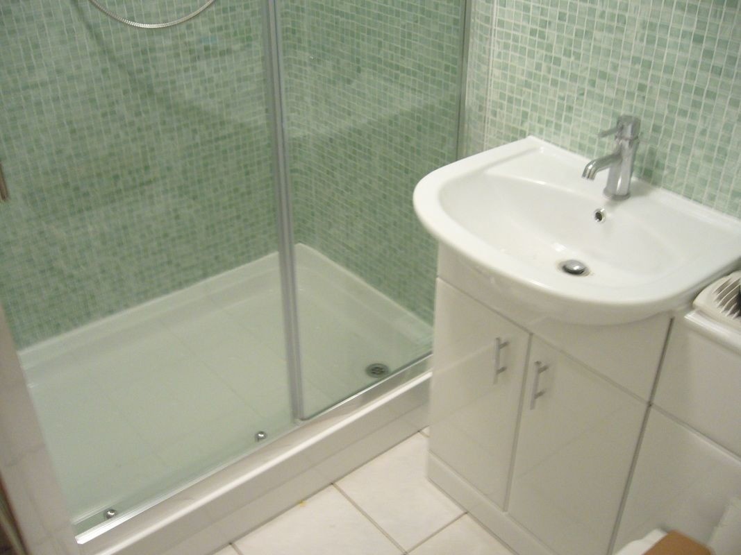 Buying Tip:

If you are looking for a new shower cubicle buy a shower tray with upstands (a lip that runs around the top) - they are much less prone to leaking and work perfectly with tiles or bathroom cladding:

wu.to/os9zUw