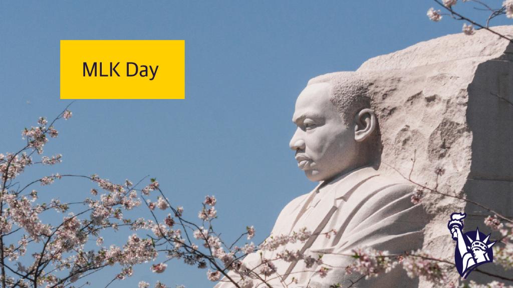 A yellow text box reading "MLK Day" is overlaid on a photo of the granite statue located at the Martin Luther King Jr. Memorial in Washington, DC