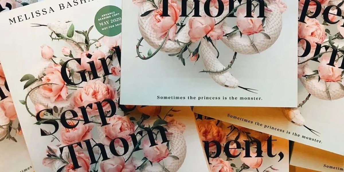 Copies of Girl, Serpent, Thorn by Melissa Bashardoust in a pile