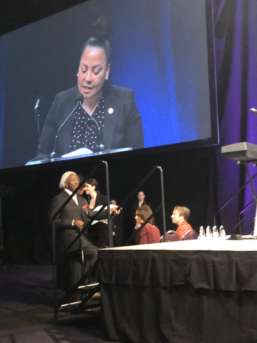 stickfiguregods's tweet photo. #mlkbreakfastbos District Attorney Rachael Rollins introducing Drum Major Award recipient Marvin E. Gilmore, civil rights pioneer, stormer of Normandy Beach, and musician as he dances up to the stage. https://t.co/itdubfk1ru