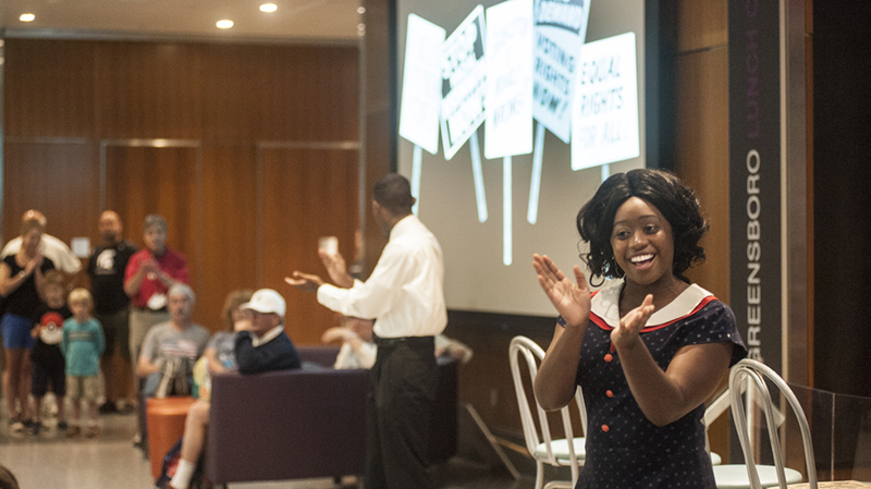 Actors provide a non-violent sit in training. 