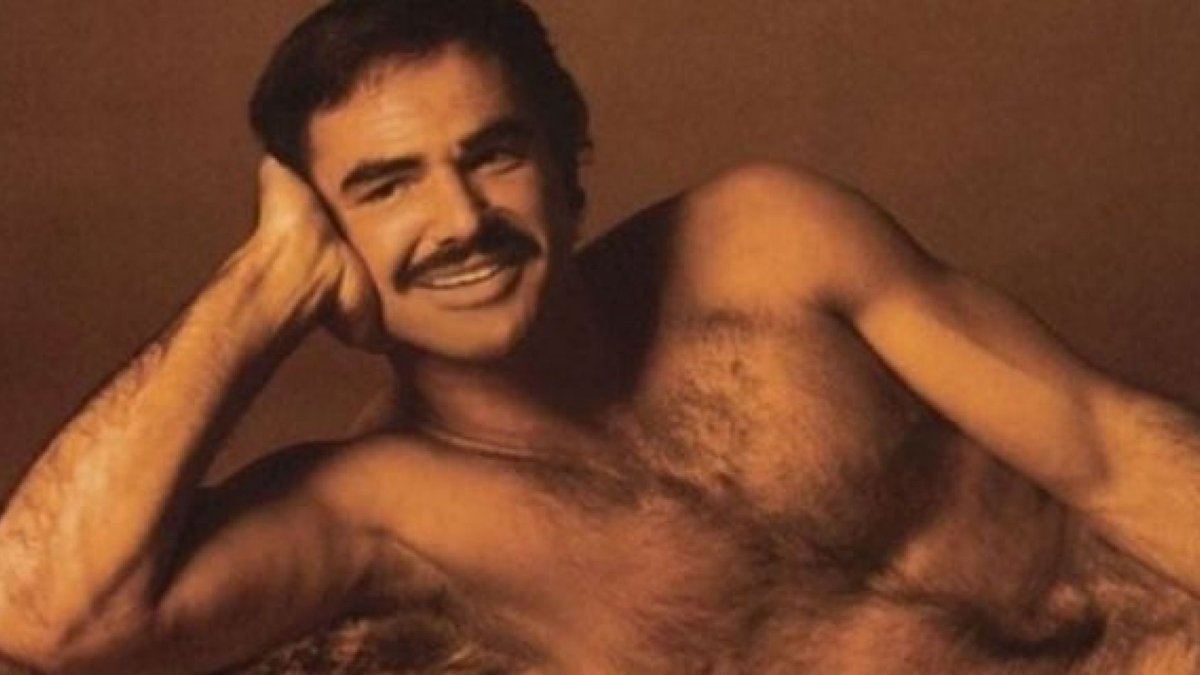 Burt Reynolds laying naked on a bearskin rug. 