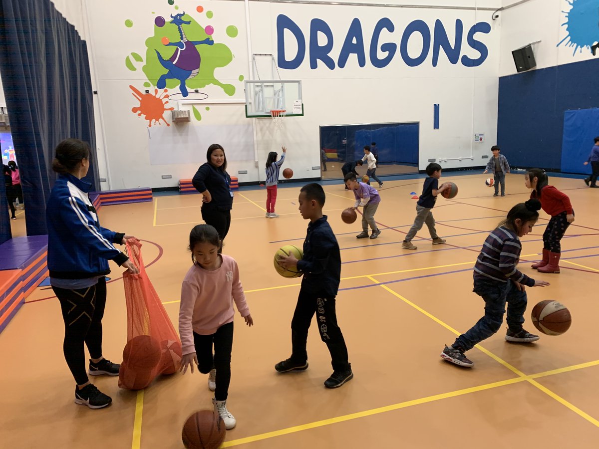 Integrating math into P.E. getting ready for the 100th day of school by counting how many hops we do in 100 seconds, how many times we bounce a ball in 100 seconds and bouncing a ball 100 times. #learnISB