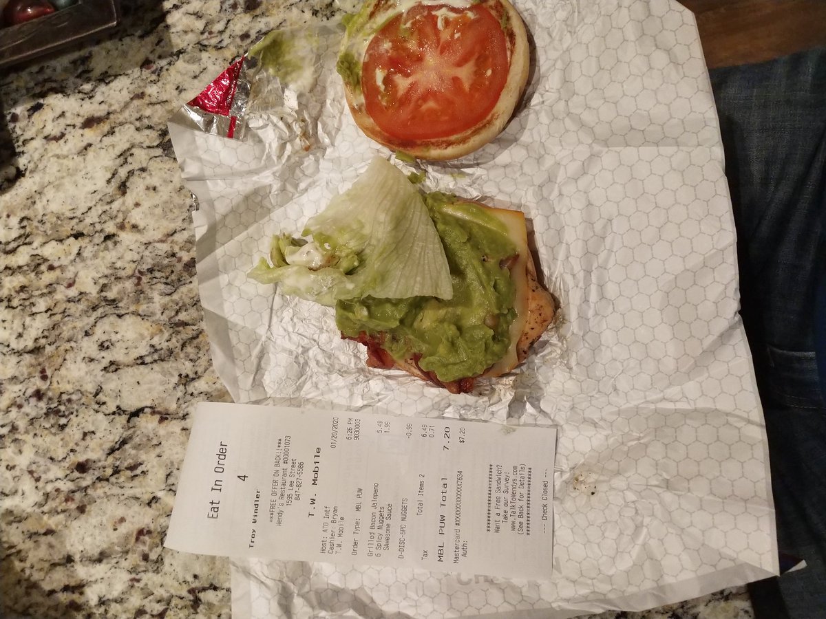 TroyWindler's tweet photo. @Wendys store 00001073 gave me the wrong (and disgusting) food. Ordered grilled bacon jalepeno chicken sandwich, got something with guac, lettuce and tomato. I hate guac, lettuce and tom and won't be eating this. Mobile order with drive thru pick up. Extremely disappointed! https://t.co/M9WivXZCg6