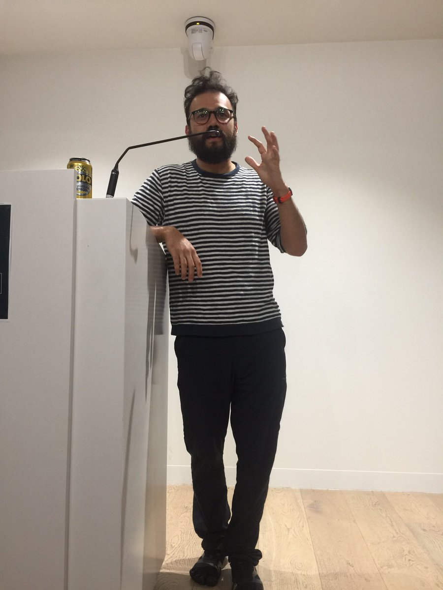 Andy at the podium sharing his ideas