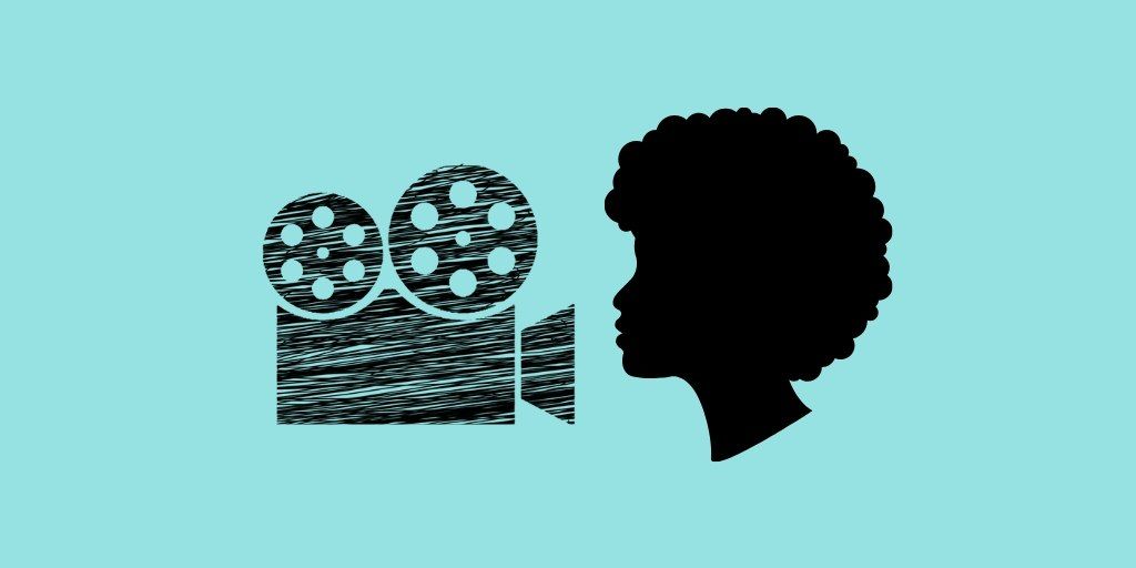 Silhouette of a woman's head facing a video camera