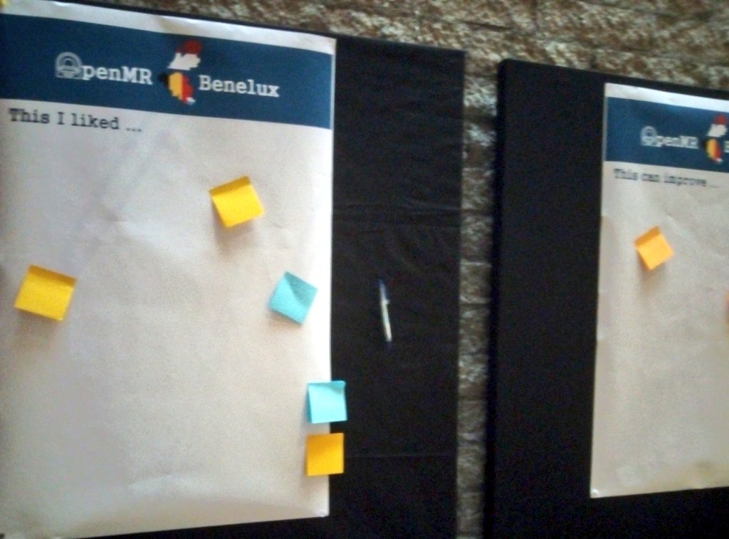 Boards with post its and pens saying 'this I liked' and 'this can improve'