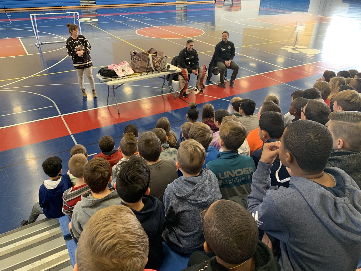 DAISCommunity's tweet photo. VP of operations Helmer and Goalie Trust from the Hershey Bears speaking with our students about careers in sports. #DAISPEP https://t.co/xma68Upupx