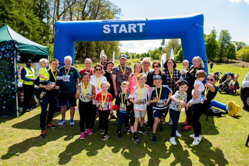 Happy family at the start of a race