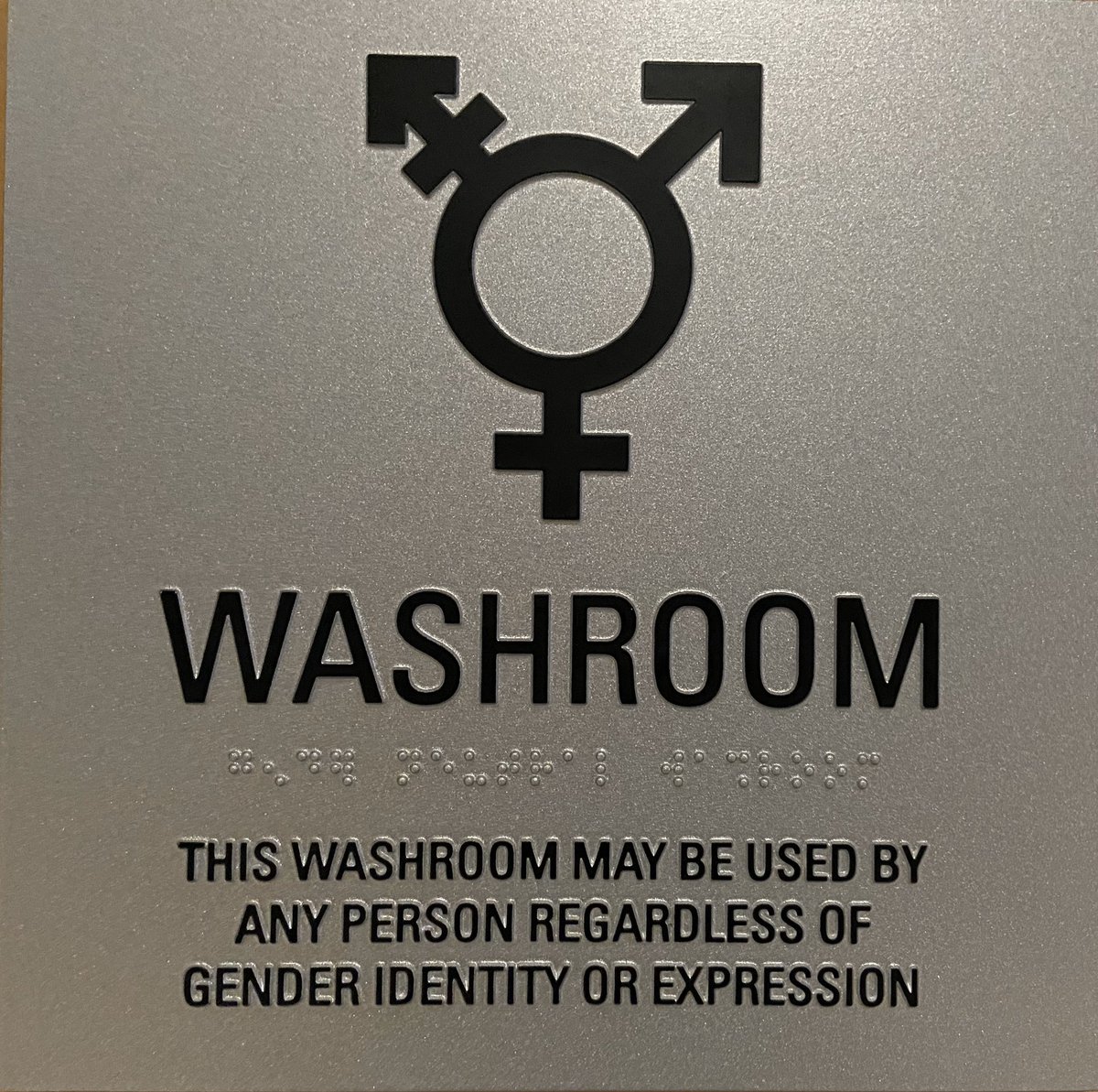 TDotGayCop's tweet photo. The @VillageTownCops &amp; I proudly giving the thumbs up today to our two (yes two!!) new gender neutral washrooms outside of @TPS51Div community room for anyone to use. https://t.co/XVT9Nhs84D