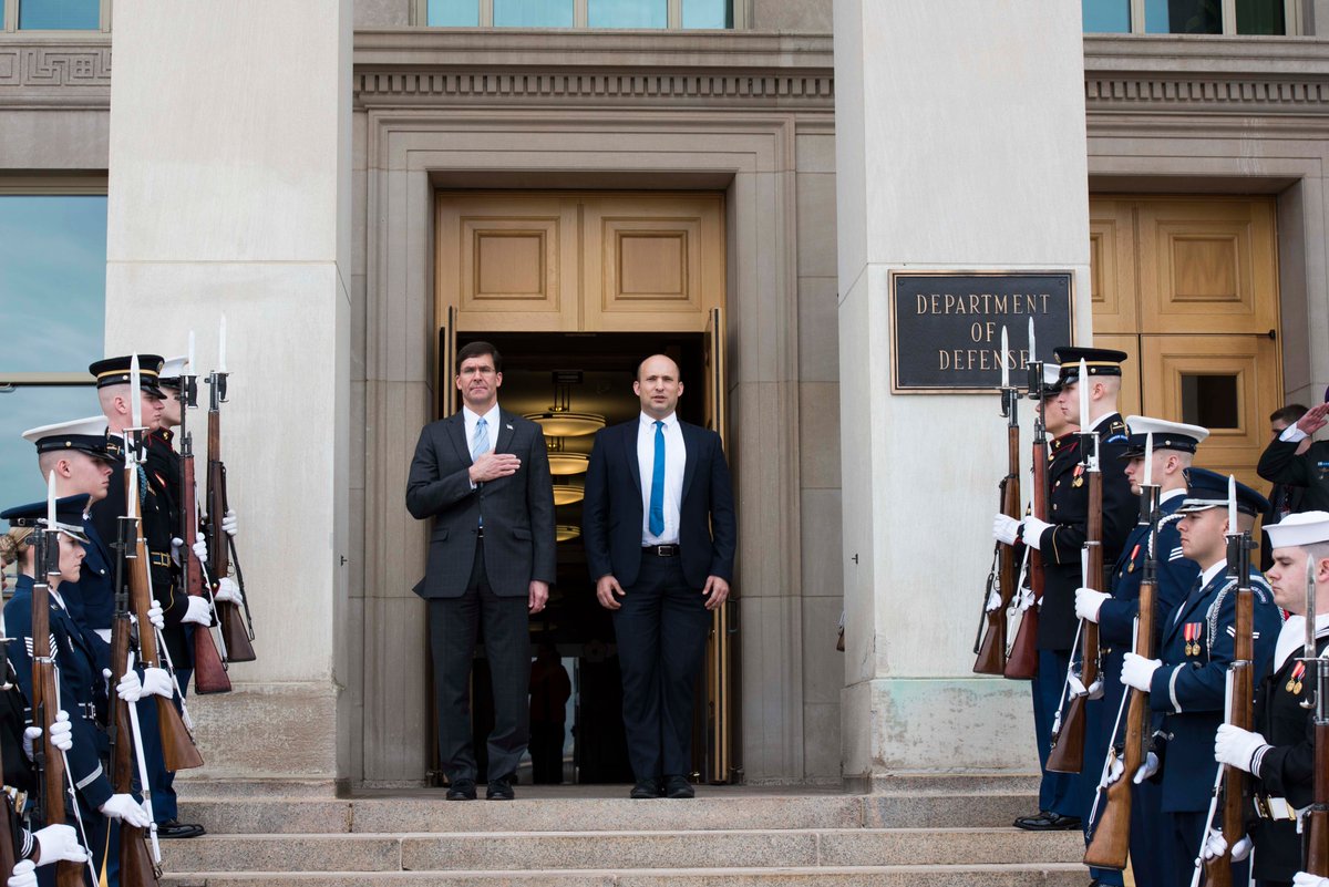 Esper, with hand over heart, stands on Pentagon steps with Bennett during outdoor honor cordon.