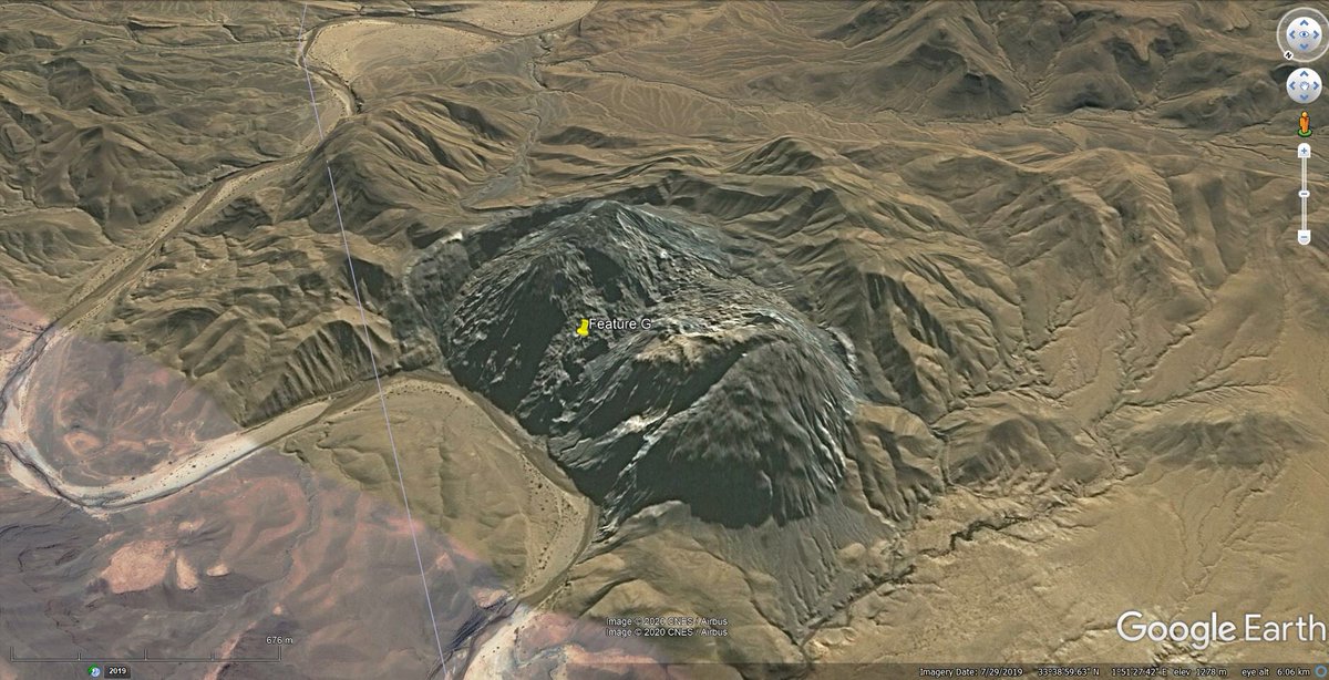 So, after posting the thread, I came across this similar feature about 153km to the NE. https://goo.gl/maps/Co8j5iw295LrgpYT7It’s called Kaf El Melh - and it has outcrop photos!These make it pretty obvious the feature is a salt diapir, and there looks to be basalt blocks in there too!