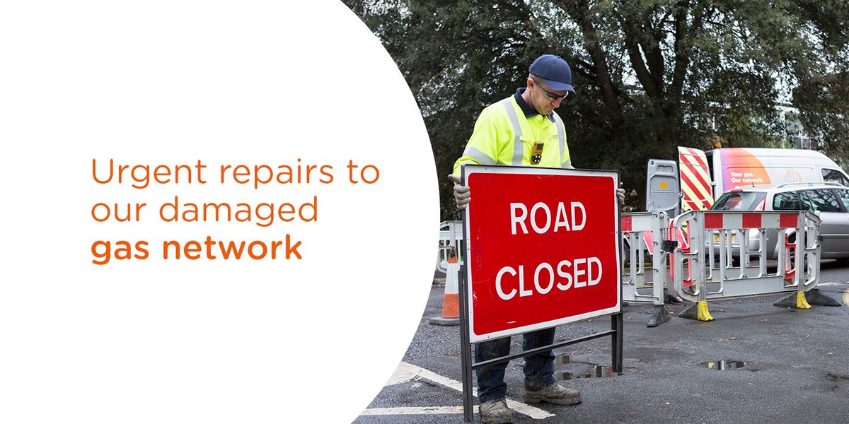 Urgent repairs to our gas network. Image shows an SGN engineer with a road closed sign.