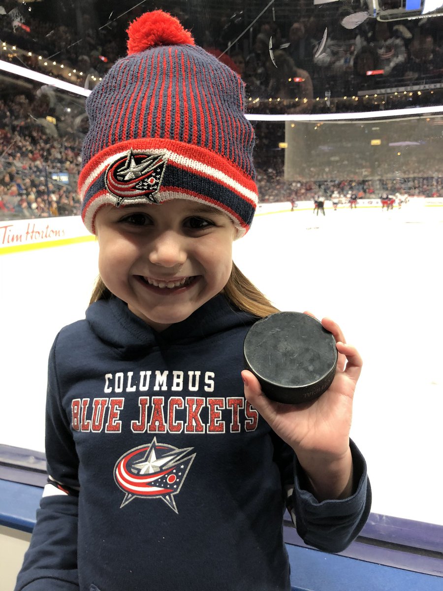 Mkappas51's tweet photo. This guy is talented...puck off the netting, onto the scoring lamp above and dropped down into her hand!!!  Thanks for the puck @CamAtkinson13 !!!  You made her night.  BTW...she calls you “Cammy” 😂🤷‍♂️#CBJ @BlueJacketsNHL https://t.co/zaxOtydcAJ
