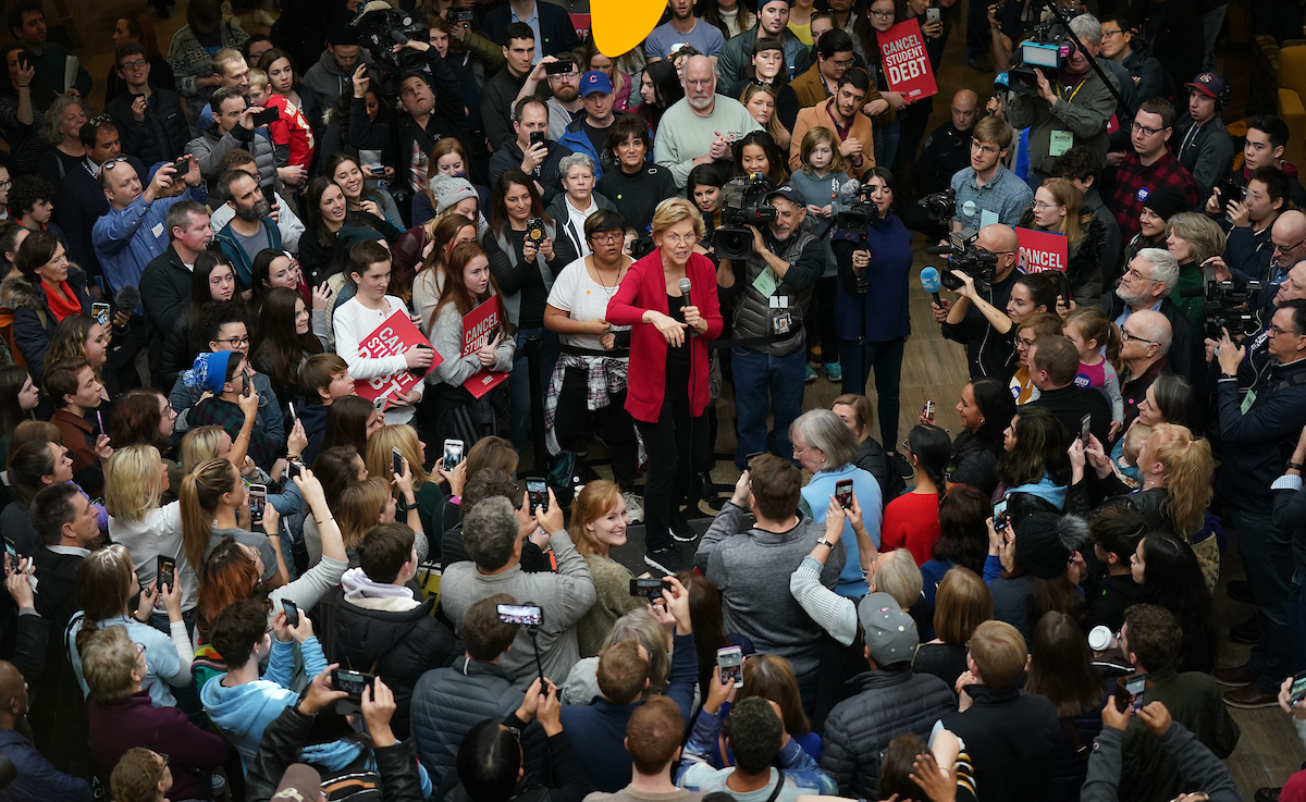 A crowd of supporters surround Elizabeth Warren at the Indianola rally.