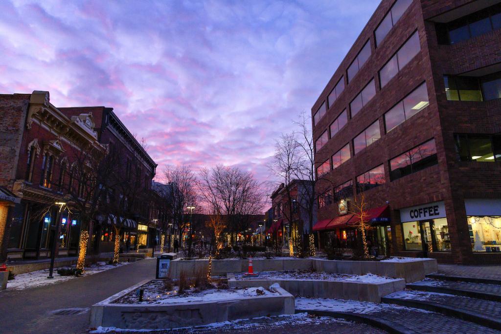 The sky is a mix of purples and blues at dusk on the Ped Mall. 