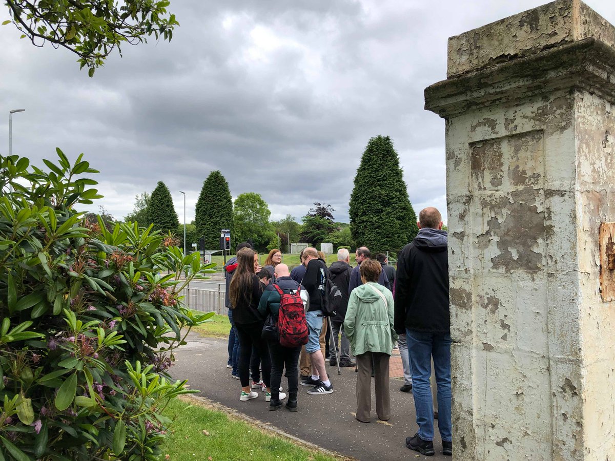 The walk waits at traffic lights, getting ready to cross the road