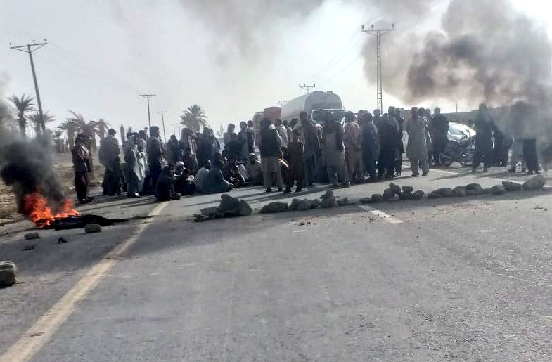 Local residents of Yakmach in Chagai district begin a sit in on RCD highway after blocking it against crack down being carried out by local administration against Iranian oil.