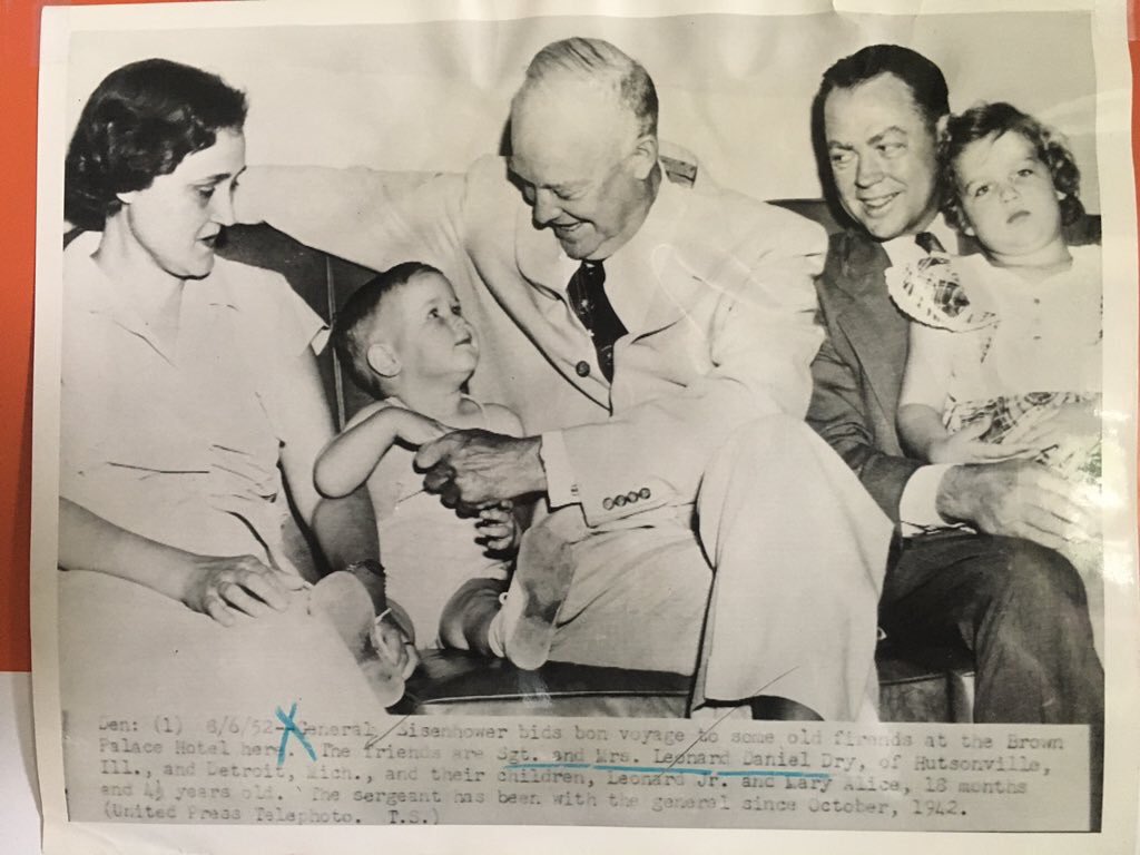 Photo from August 6, 1952 of my grandparents sitting with General Eisenhower who is playing with my uncle while my mom stares at the camera