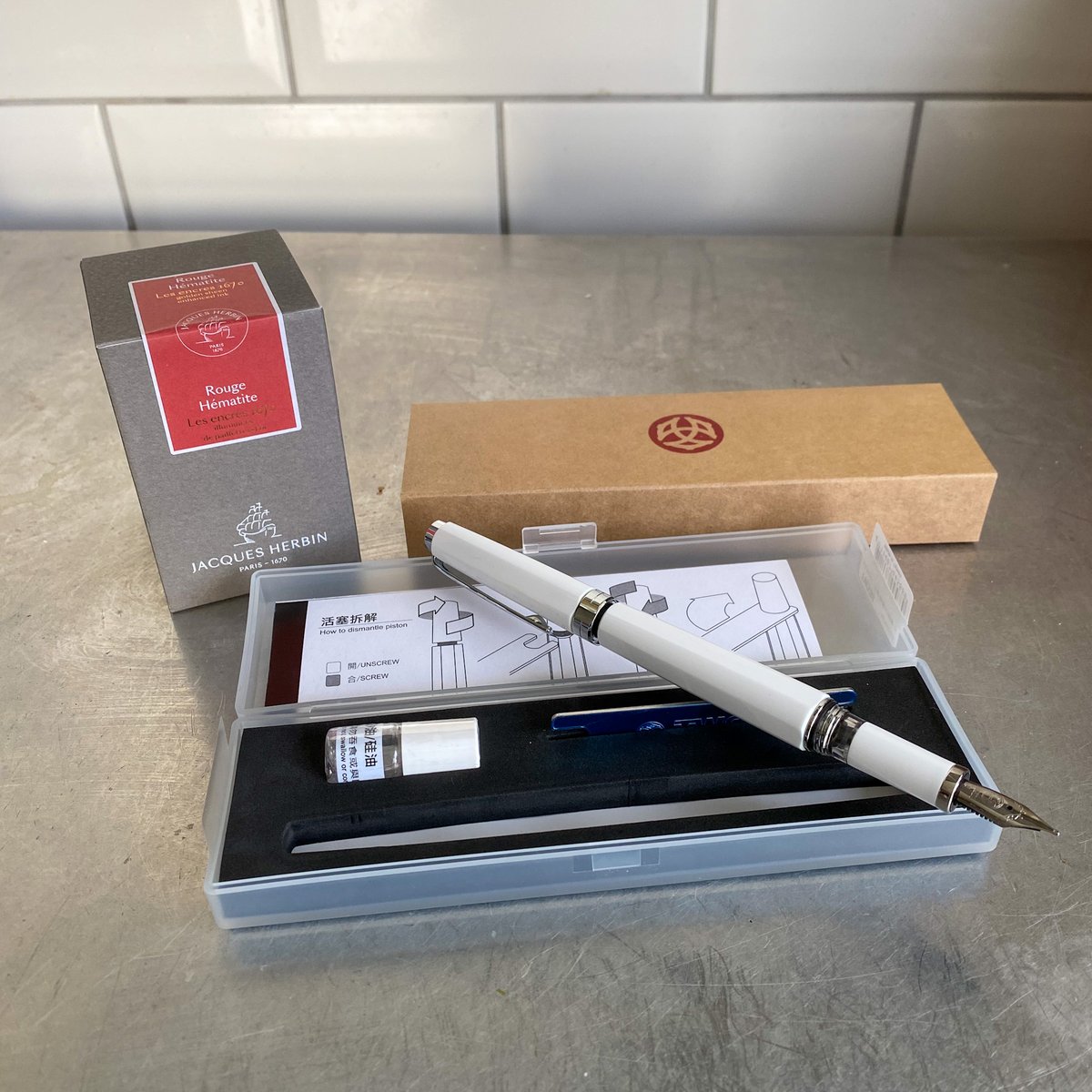 New pen day! A TWSBI Classic with a broad nib and some Jacques Herbin Rouge Hématite. <a href="/twsbi/">TWSBI</a> <a href="/jacquesherbin/">Jacques Herbin</a> #newpenday #npd #foontainpen