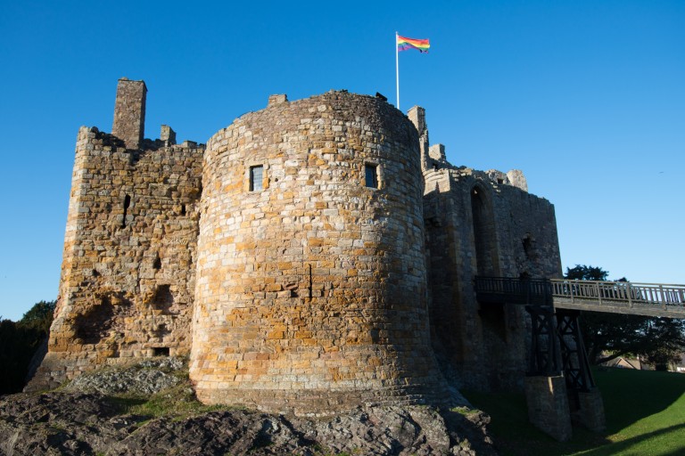 A rainbow flag flying from Dirleton Castle