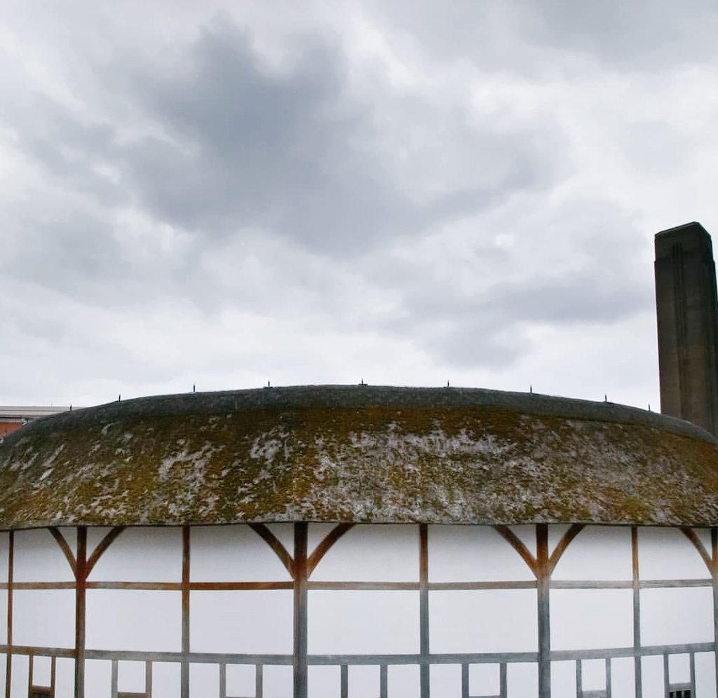 A cloudy sky over the roof of the Globe Theatre.