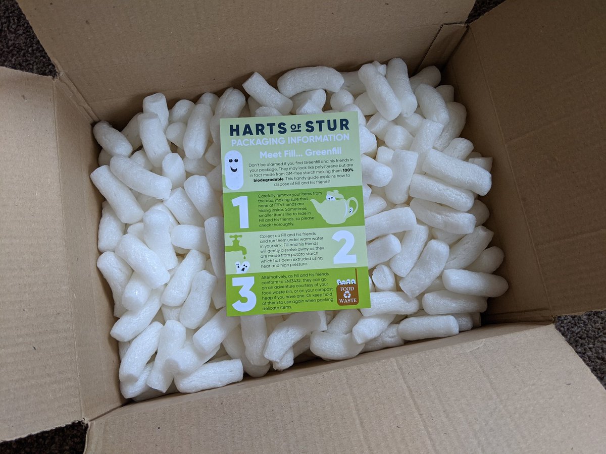 The peanuts in a cardboard box.