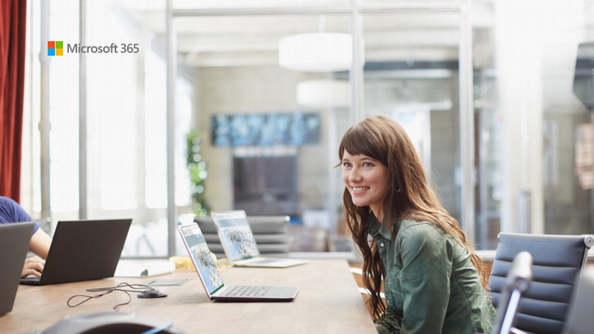 Photograph of a professional woman smiling at work