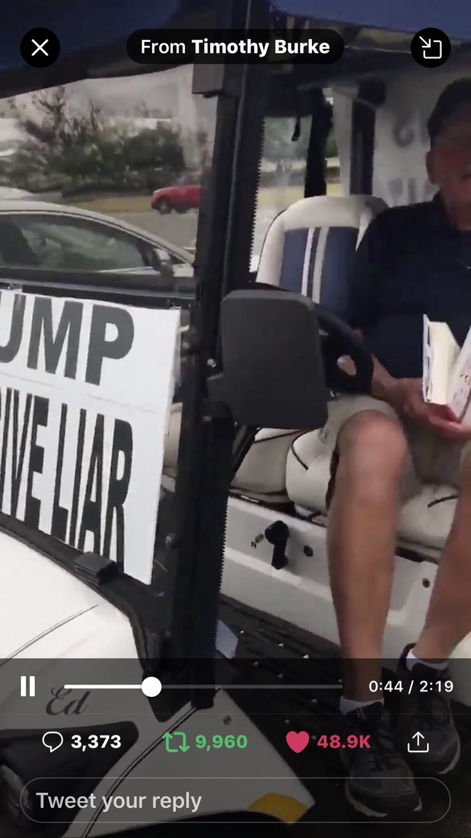 Occupy_FL_HOA's tweet photo. @joncoopertweets Gotta LOVE this guy readN, “A Very Stable Genius”, while accosted by some crazy woman “on theOutside”😉 insisting he’s somehow theAggressive one sitting N his golf cart reading his book UNWILLING2 #AcquitTheGuilty #TrumpCompulsiveLiar #TrumpIsASexualPredator #TrumpBigotAndRacist https://t.co/6EzFn3FtOV
