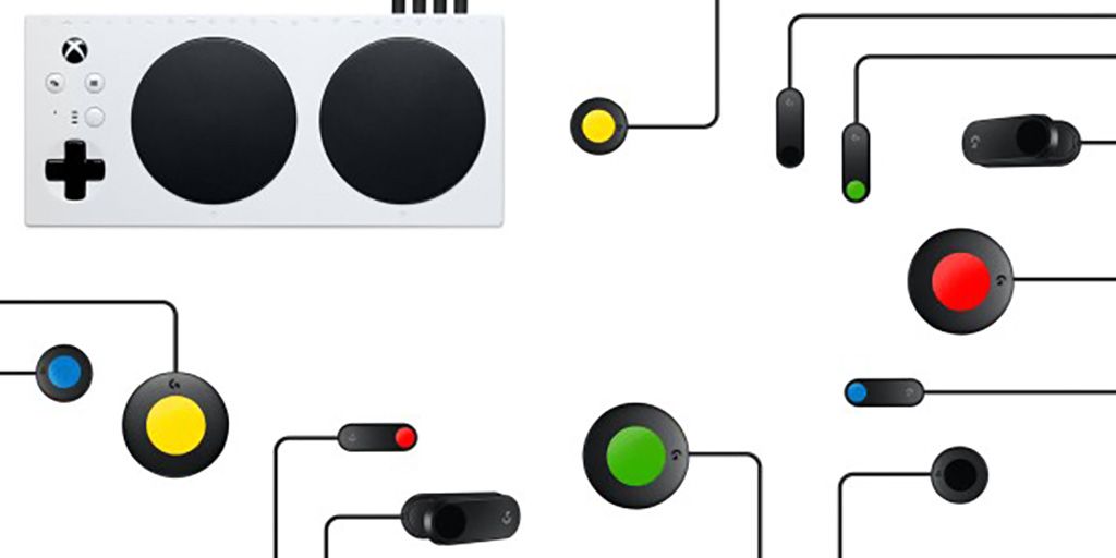 The Xbox Adaptive controller laid out on a white background. 