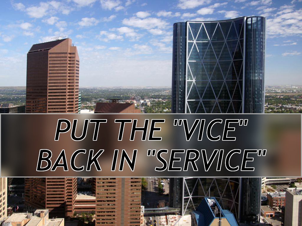 A tall, curved skyscraper as seen from a nearby skycraper