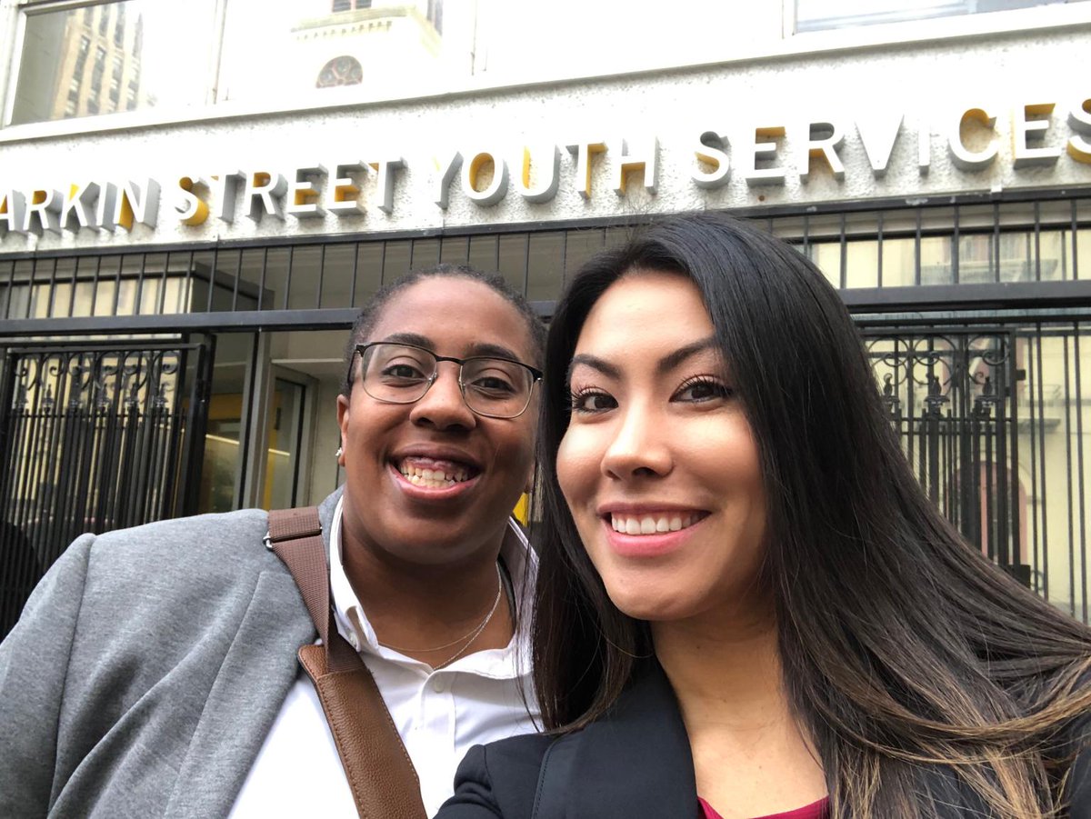 Verizon's Sophia Garcia and Christine Keener take a selfie in front of the Larkin Street Youth Services building.