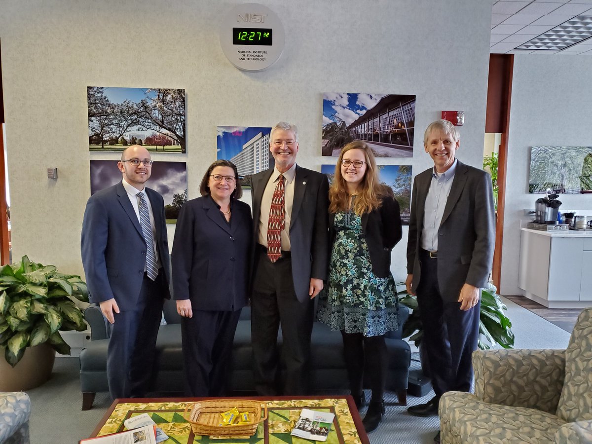 Group of people pose together for a photo.