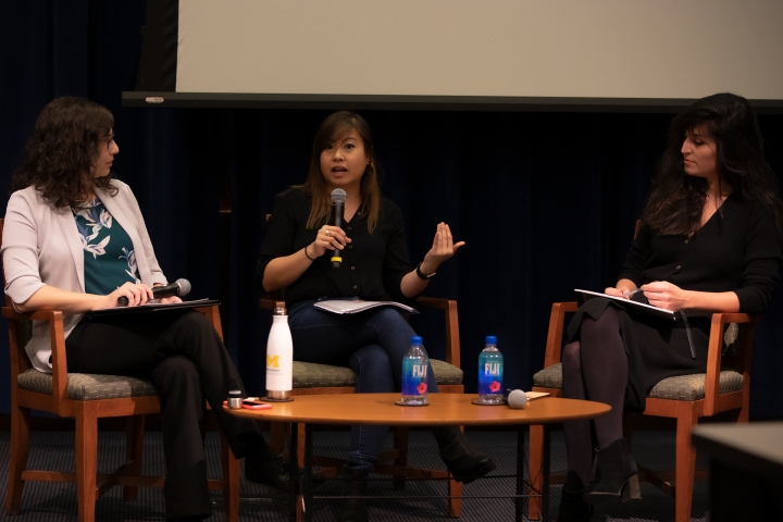 students sitting at a panel discussion
