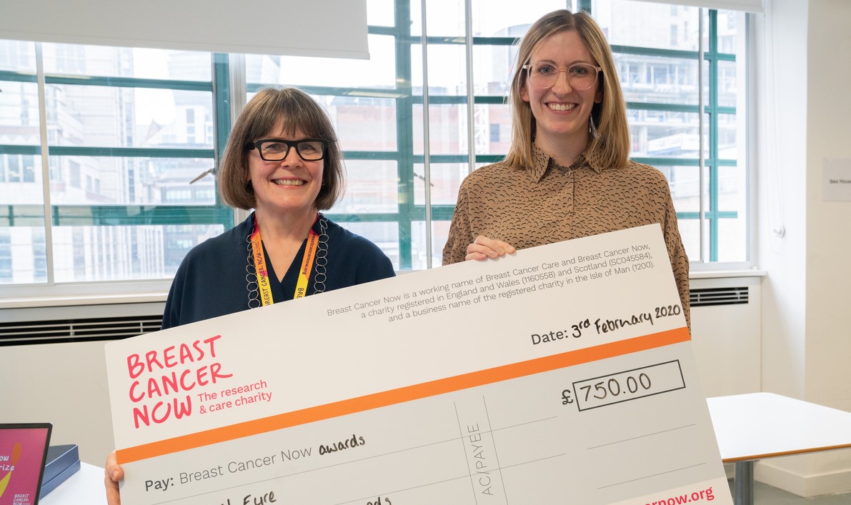 CEO of Breast Cancer Now Delyth Morgan presenting Dr Rachel Eyre a cheque
