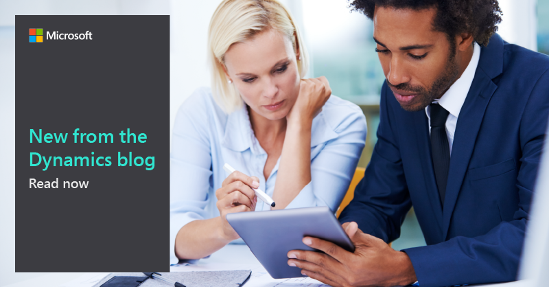 Two business professionals view tablet screen. 