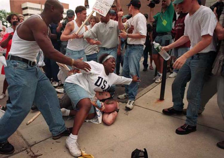 Keshia Thomas protecting a Nazi-ish type from being beaten up by her allies.