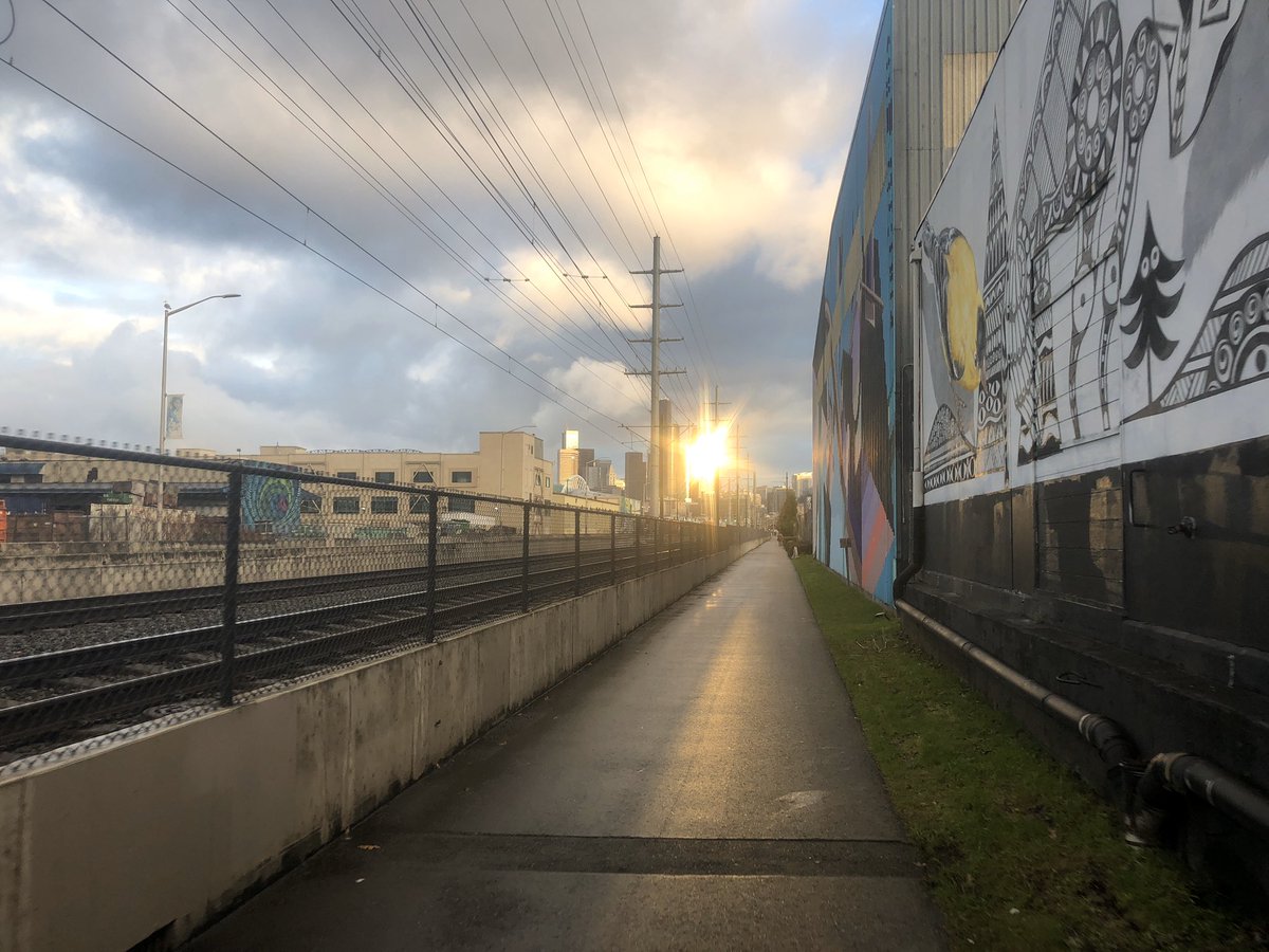 Sun reflecting off building downtown on the SODO Trail