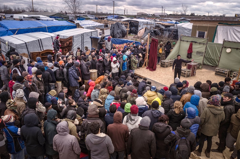 Hamlet in front of an audience in the Jungle, Calais. 📷 Sarah Lee for The Guardian.