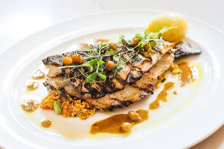Grilled Branzino - served with spiced couscous mix, avocado, grapefruit, crispy chick peas &amp; curry cardamom sauce. #BrasserieRuhlmann #French #Brasserie #RockefellerPlaza #RockCenter #Midtown #NewYorkCity #NYCeats #NYC