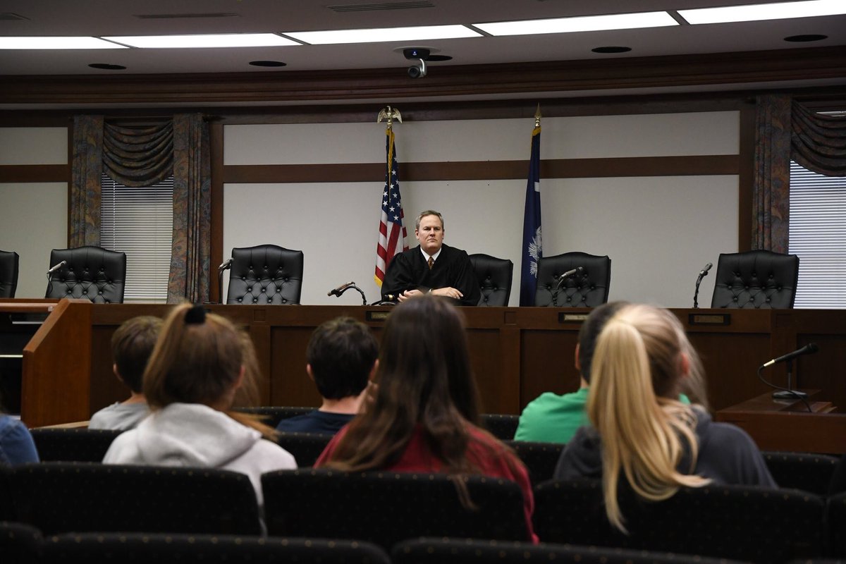 LexingtonPD's tweet photo. The afternoon was spent learning the judicial side with a scenario involving the @Solicitor_11th and a visit with @TownLexingtonSC Judge Brian Jeffocat and Attorney Cliff Koon.
Each child was presented a certificate from Chief Terrence Green to end the event. #Lex1NGHD https://t.co/hTPpqOYHlF