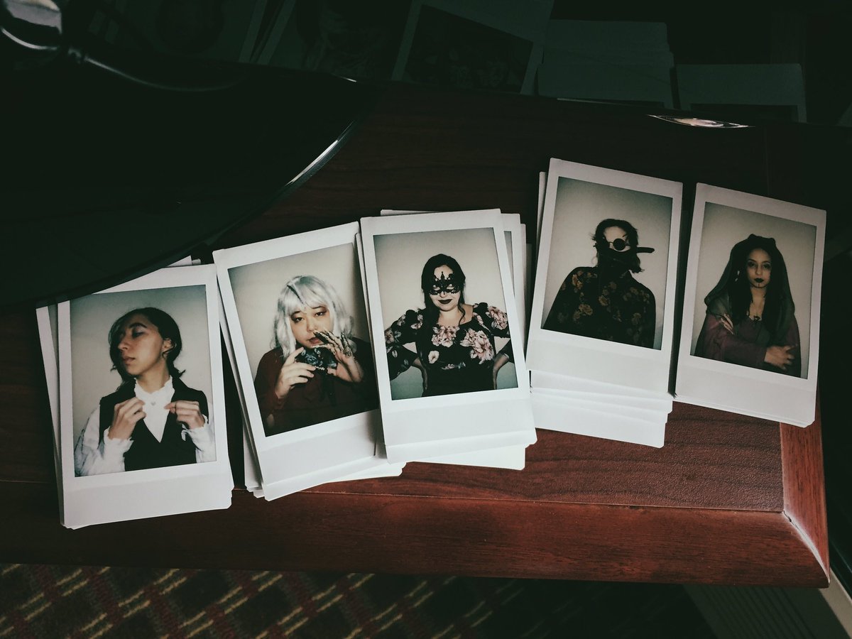 Instax photos of Hadeel, Lysa, Ashley, Kayla, and TK dressed in costumes from Tales from the Mists.