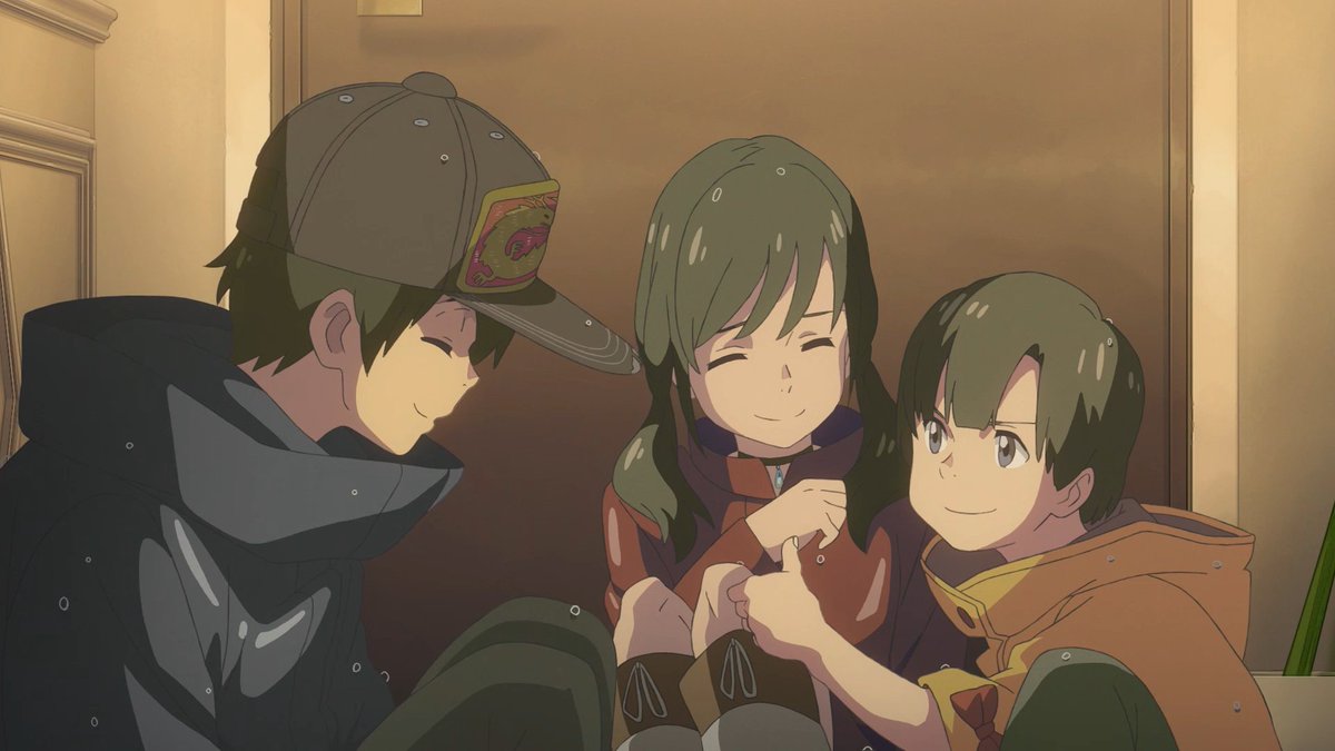 Still from the animated film Weathering with You. In the image, three young adults are huddled together covered in big wet raindrops. The guy on the left is wearing a cap and navy hoodie and smiling at a girl with bangs and her younger brother who are sitting closely together. The little brother is doing the thumbs up sign with the others giggle.