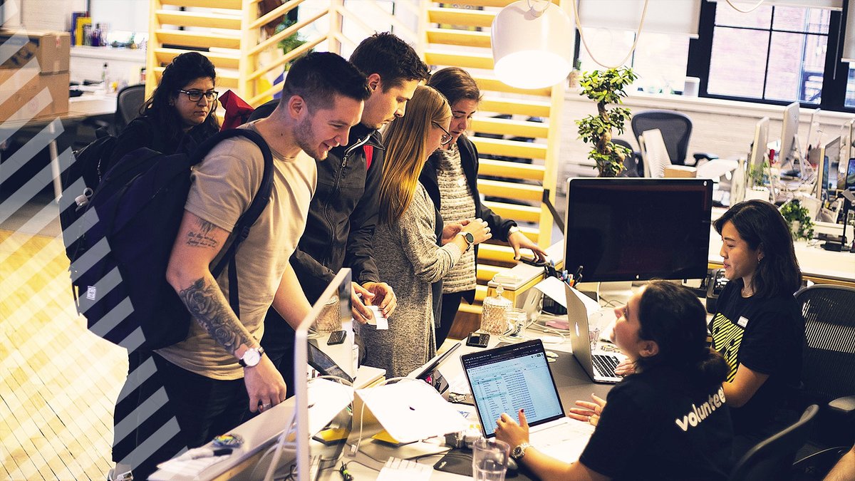 Overhead shot of our first group of attendees registering with our volunteers at the Shopify office
