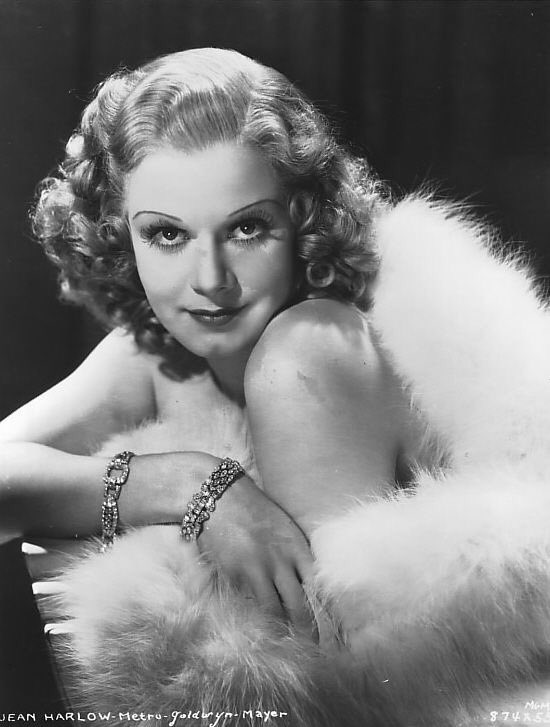 By early fall 1935, only about six months after the bleach crisis, Jean switches over to her new “brownette” color. The initial portraits are accomplished with a series of brownette wigs which Jean wears while still letting her hair grow out.