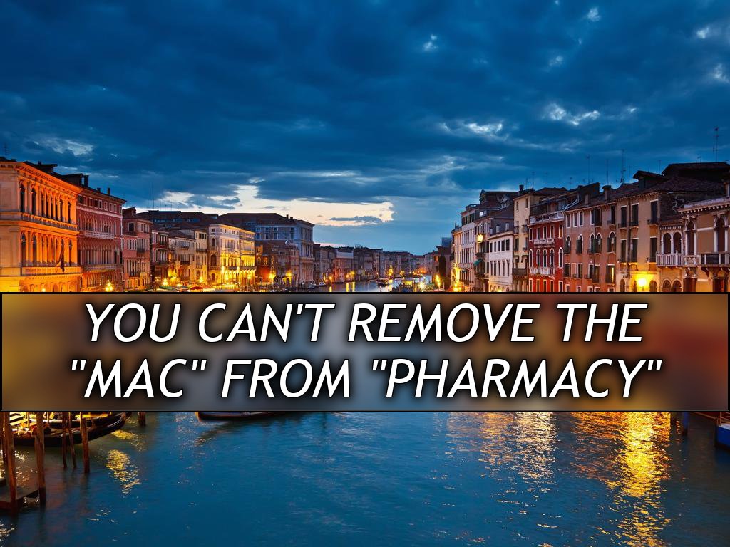 A canal in Venice at twilight, many boats are visible as well as many outdoor restaurants along the sides